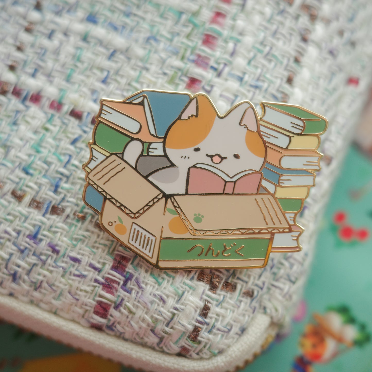 tsundoku cat - enamel pin
