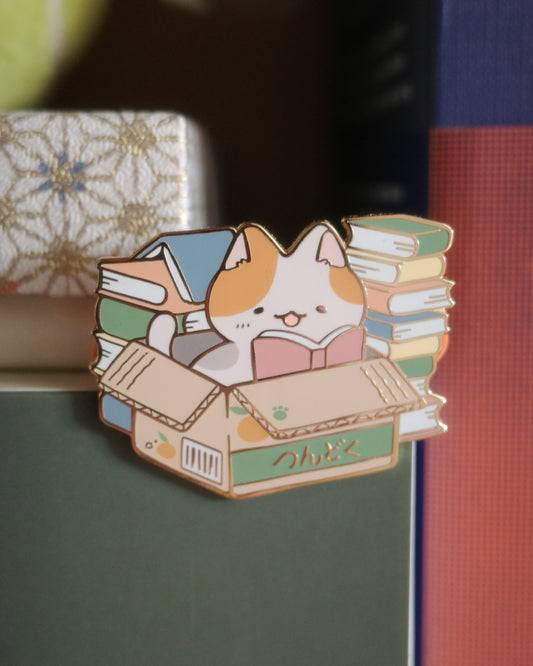 tsundoku cat - enamel pin