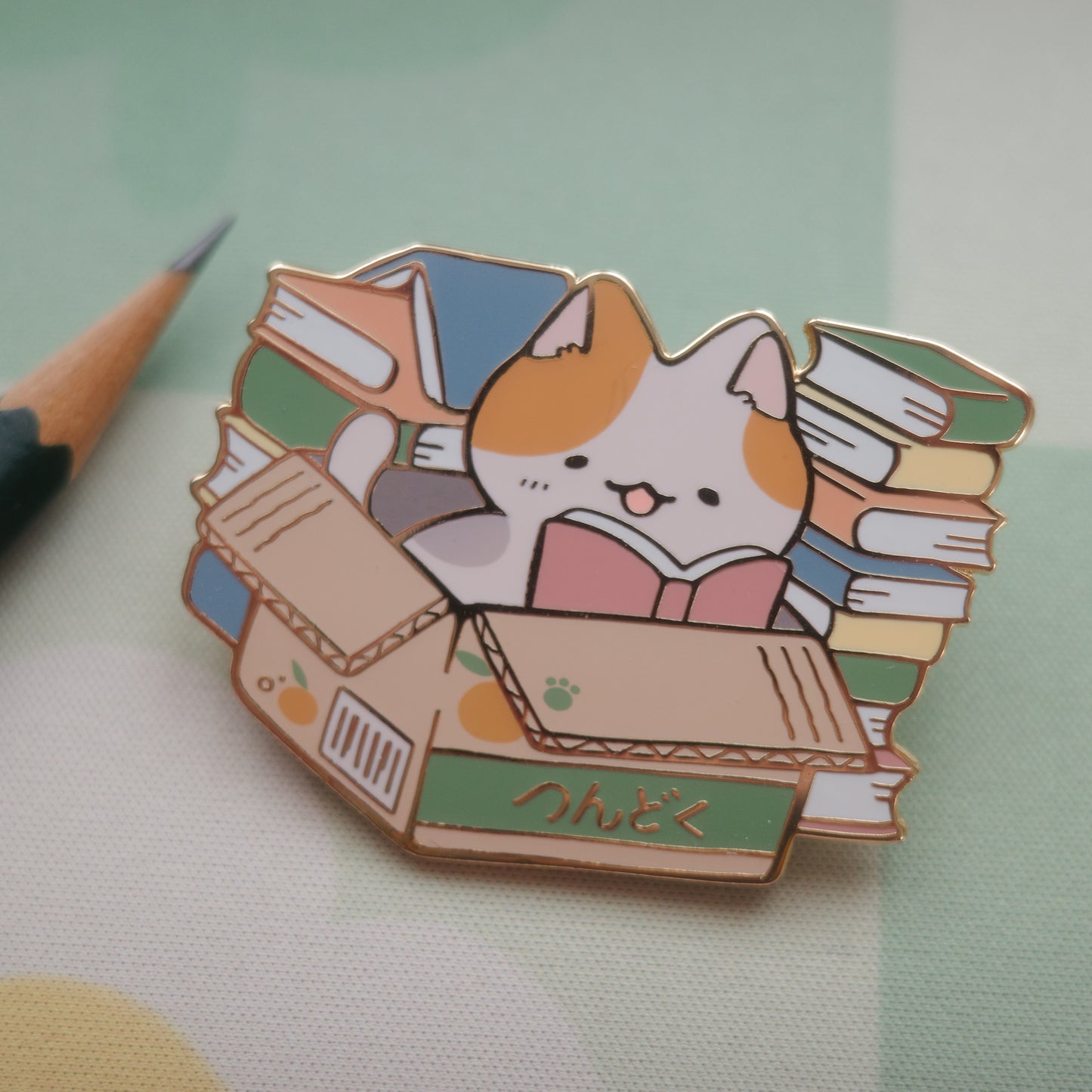 tsundoku cat - enamel pin